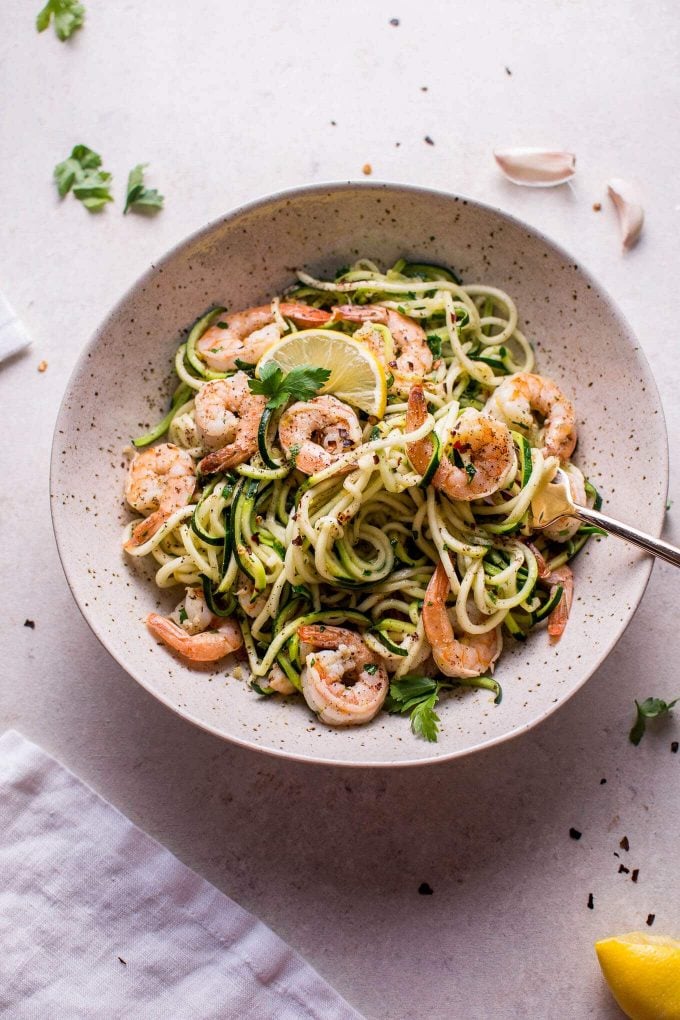 bowl of easy garlic shrimp zoodles and a fork