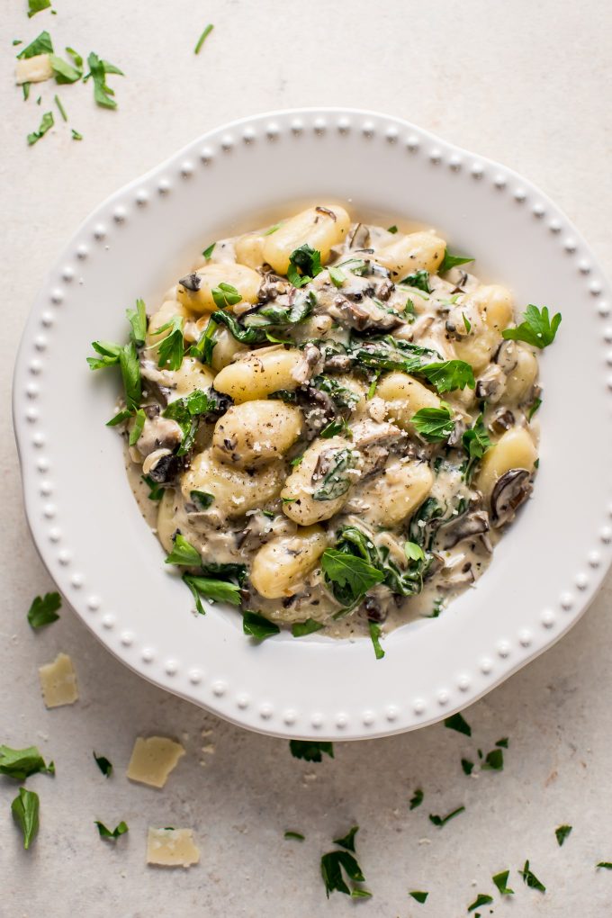 creamy spinach and mushroom gnocchi on a plate