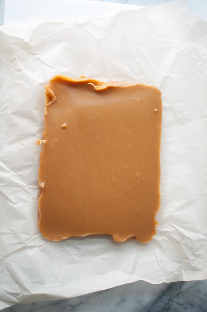 a slab of homemade caramels on wax paper