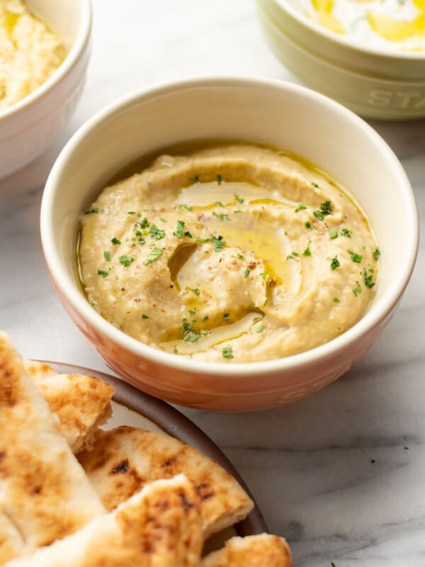 a bowl of greek melitzanosalata dip with pita bread