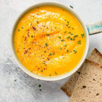 This vegetarian acorn squash and carrot soup is healthy, fresh, flavorful, and takes the chill off.