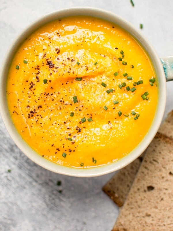 This vegetarian acorn squash and carrot soup is healthy, fresh, flavorful, and takes the chill off.