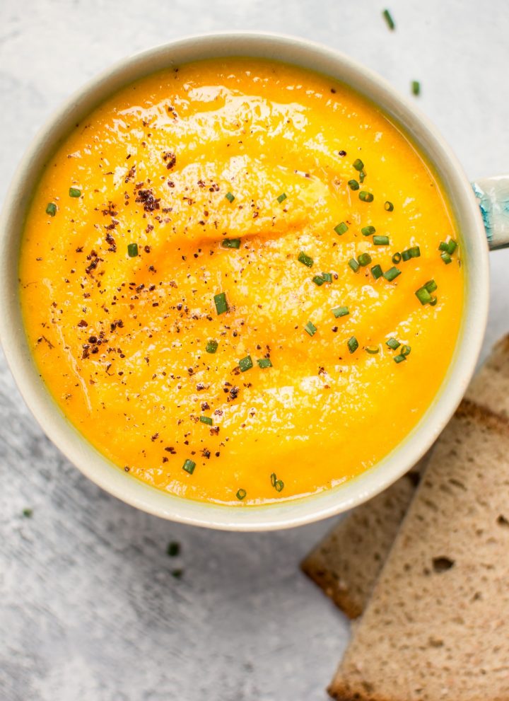 This vegetarian acorn squash and carrot soup is healthy, fresh, flavorful, and takes the chill off.