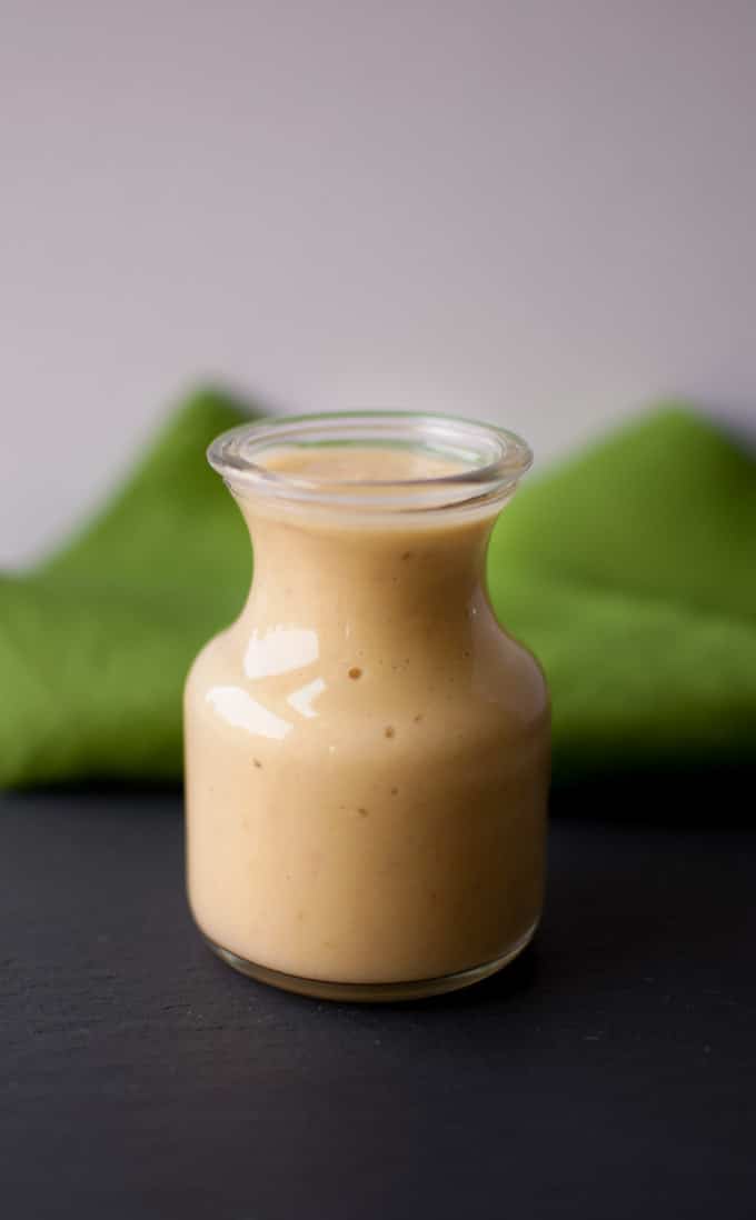 close-up of artichoke salad dressing in a glass jar