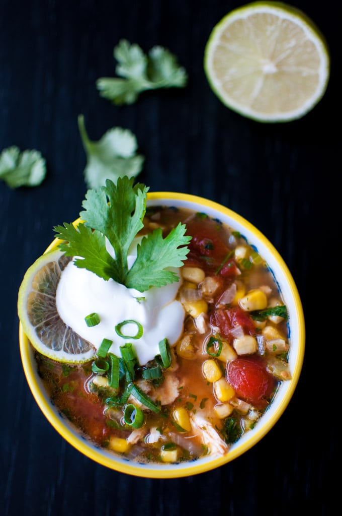 bowl with Mexican chicken and lime soup garnished with sour cream and parsley
