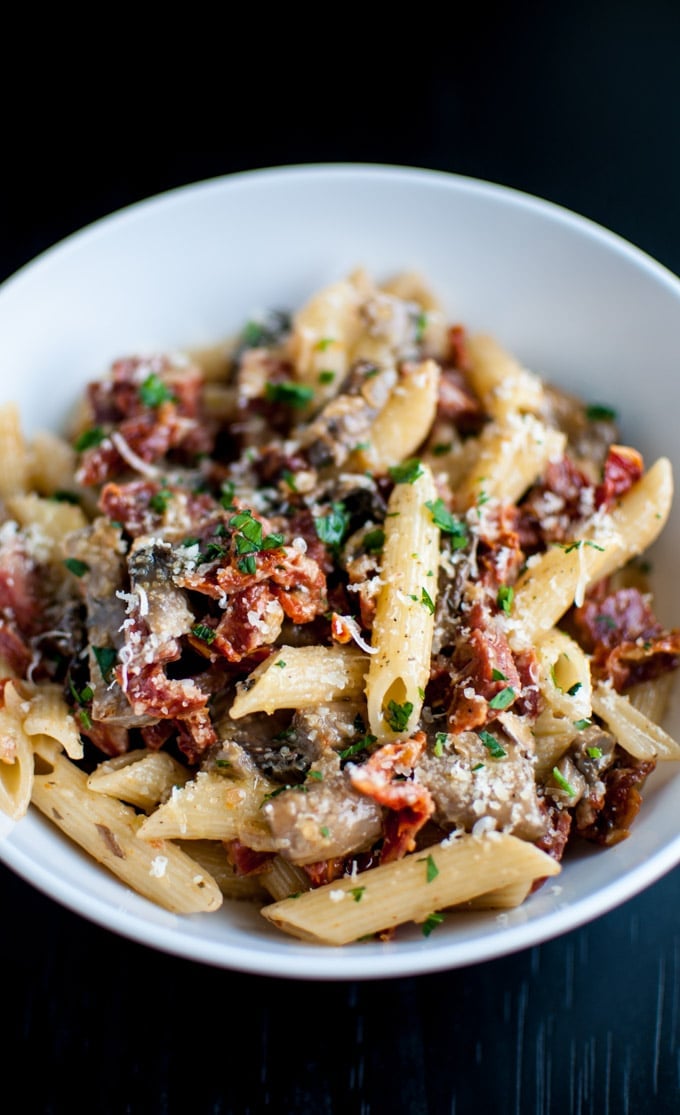 close-up with chorizo penne with mushrooms and sun-dried tomatoes
