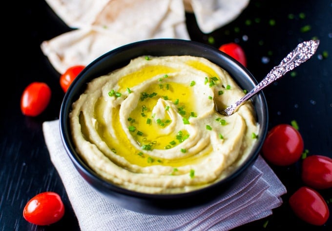 close-up of bowl of avocado and white bean dip