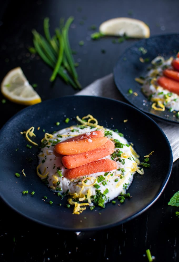 close-up of carrots with herbed yogurt in a bowl