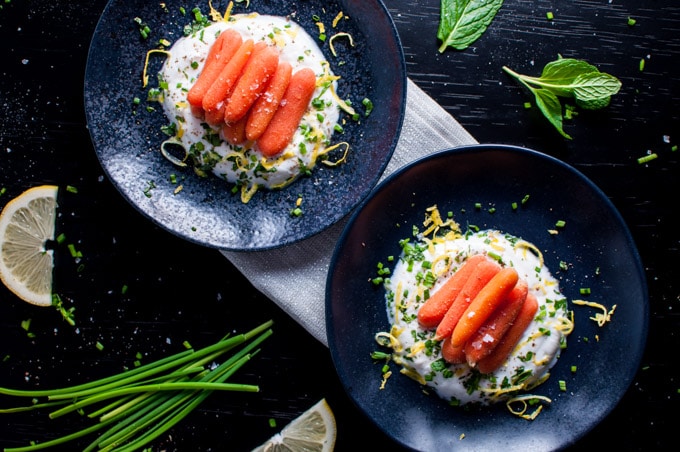 two bowls of carrots with herbed garlic yogurt appetizer