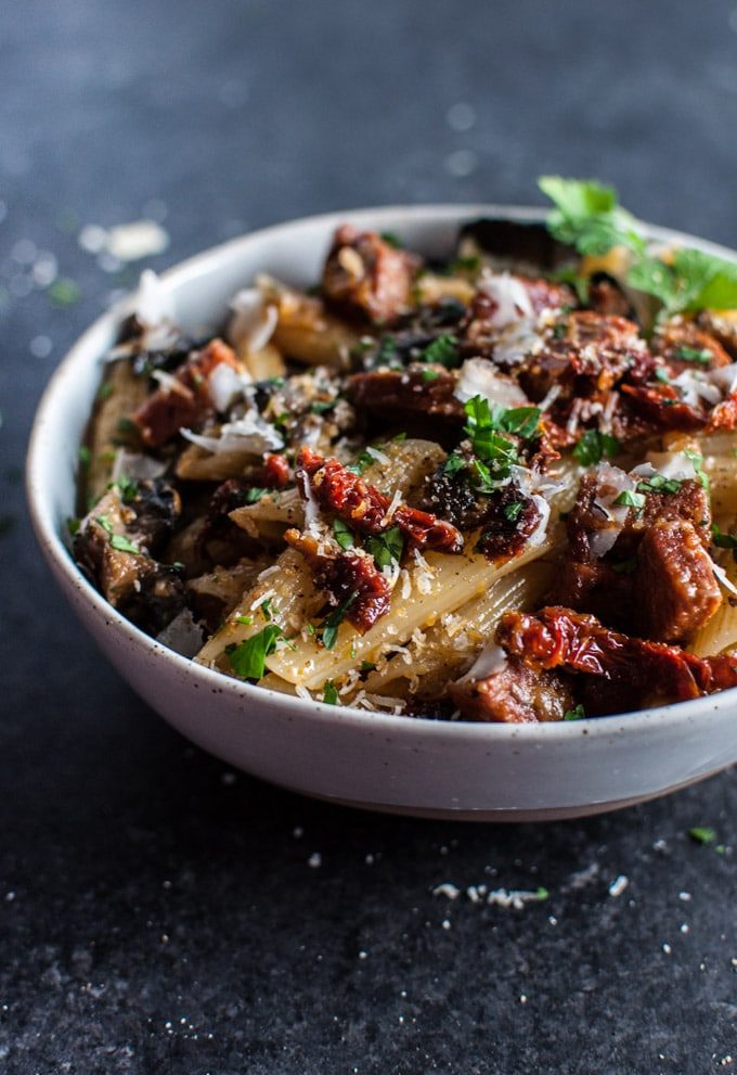 A delicious pasta dish with chorizo, portobello mushrooms, sun-dried tomatoes, and plenty of garlic!