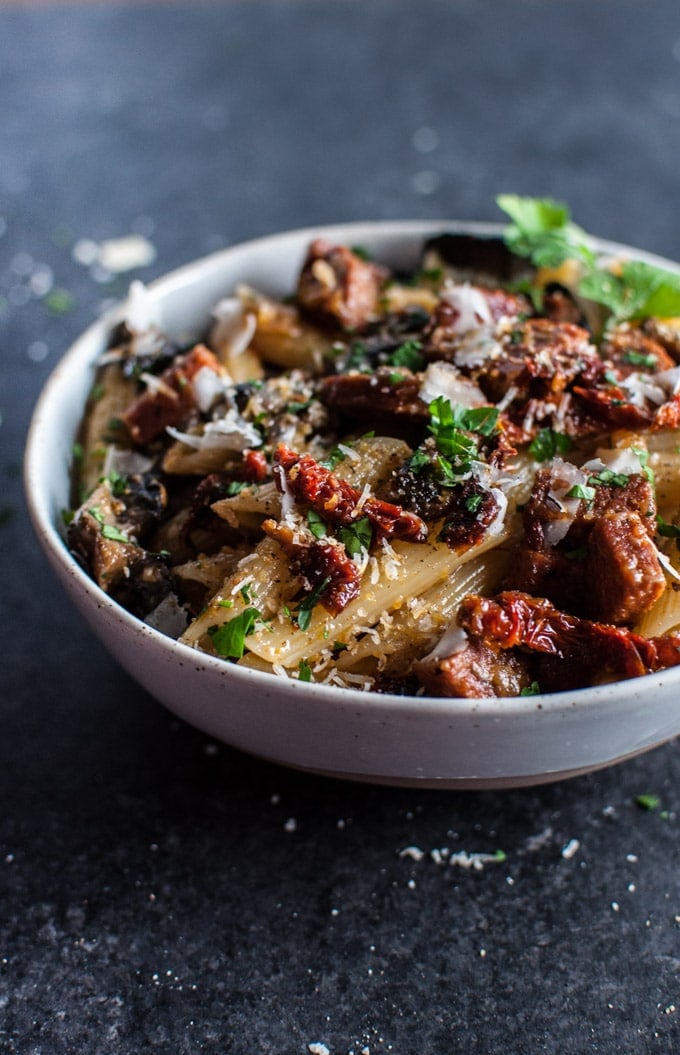 bowl of chorizo pasta with mushrooms and sun-dried tomatoes