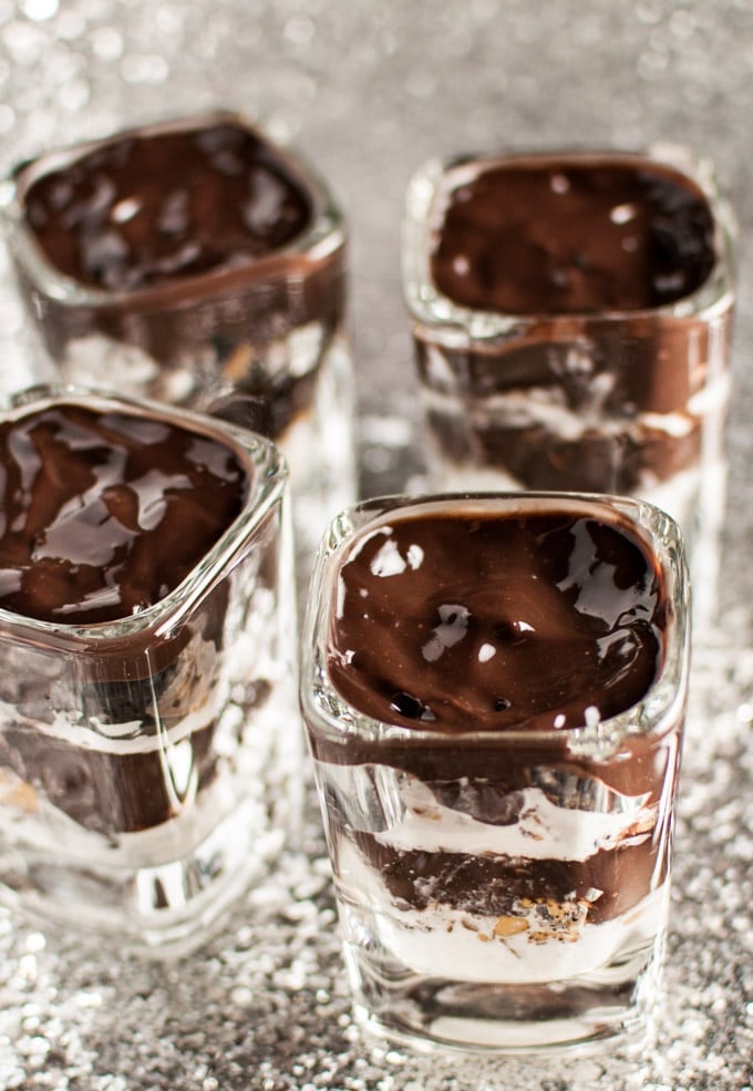 small glass containers with Reese\'s, Oreo, and chocolate mini layered desserts