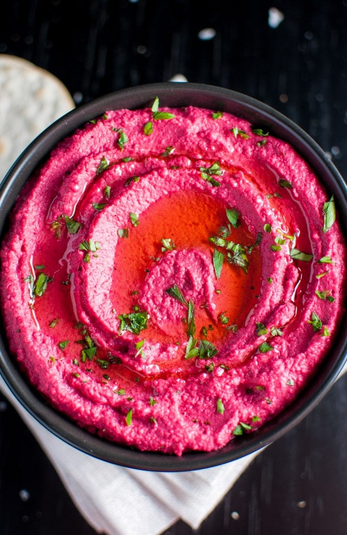 close-up of roasted beet hummus in a bowl