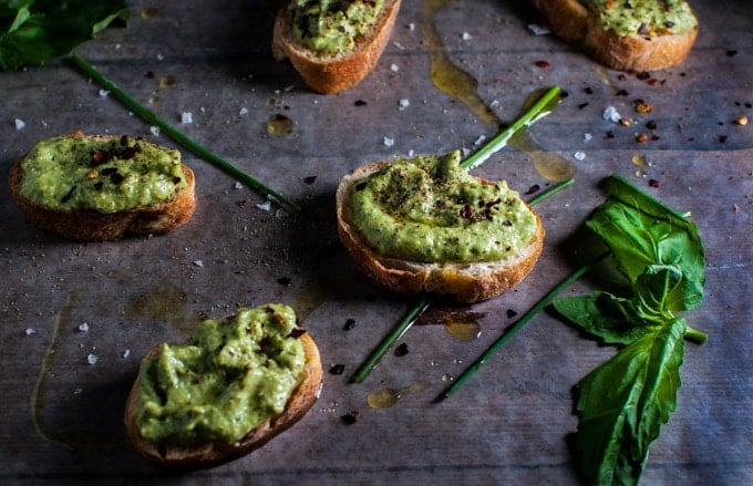 several slices of bread topped with avocado pesto