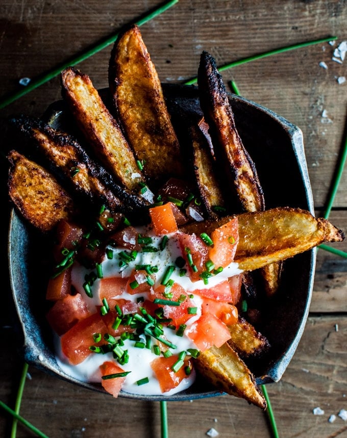 bowl of beer oven fries with veggie topping