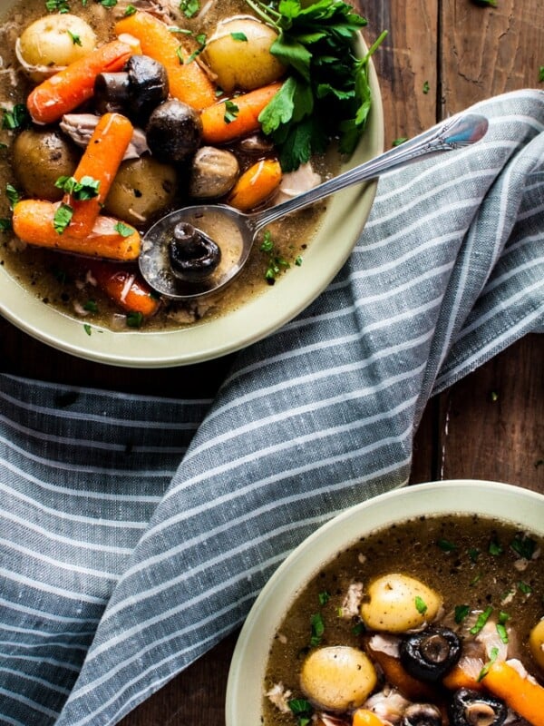 Chuck the ingredients in the slow cooker in the morning and come home to this delicious rustic Crockpot chicken stew! This recipe is healthy, delicious, filling, and will warm you up on a chilly winter day.