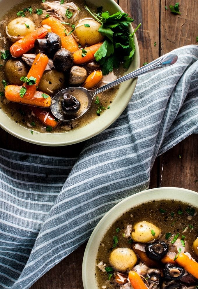 Chuck the ingredients in the slow cooker in the morning and come home to this delicious rustic Crockpot chicken stew! This recipe is healthy, delicious, filling, and will warm you up on a chilly winter day.