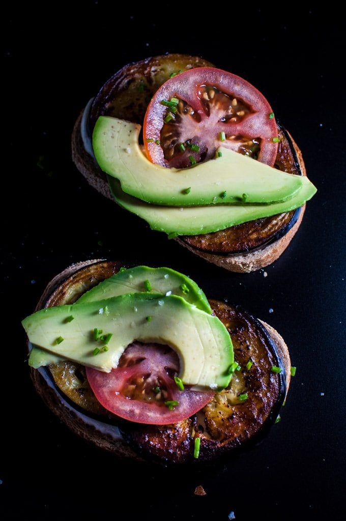 A fantastic vegetarian toast recipe with fried eggplant, avocado, tomatoes, chives, and a smoky mayo!