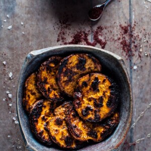 earthenware bowl with honey and sumac charred sweet potato slices