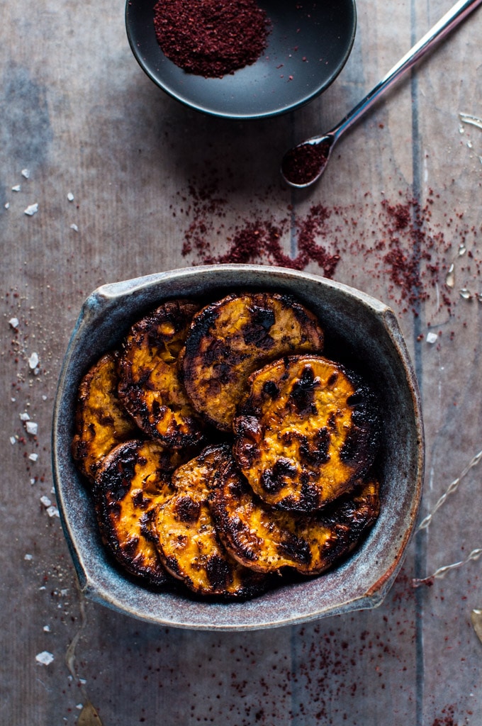 close-up of bowl with honey and sumac charred sweet potato slices