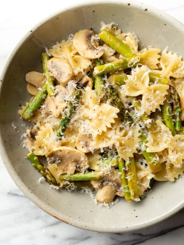 a bowl of mushroom and asparagus pasta