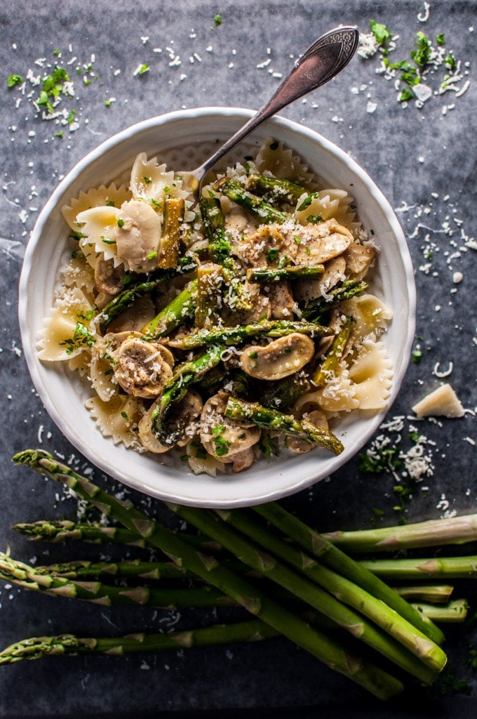 white bowl with vegetarian asparagus and mushroom pasta