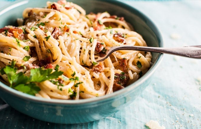 close-up of creamy bacon spaghetti with a fork