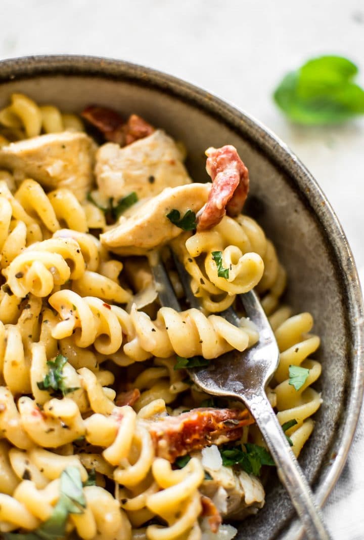 close-up of Cajun chicken pasta on a metal fork