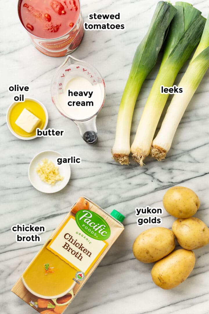 ingredients for potato leek tomato soup on a countertop