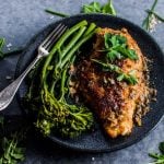 Parmesan crusted chicken breasts with a fresh herb sauce makes a wonderful weeknight meal. The parmesan breading keeps the chicken tender, while fresh chives, oregano, and parsley make the lemon butter sauce irresistible.