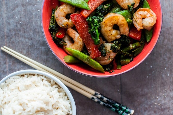 skinny shrimp stir fry in a red bowl with chopsticks and rice