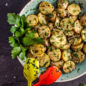 My chimichurri potato salad is packed with flavor from the fresh herbs and garlic! It's the perfect easy to prepare side dish and is ideal for those who do not like creamy potato salad.