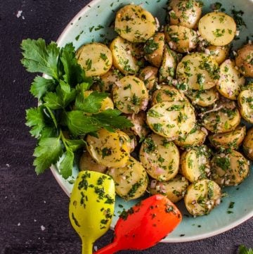 My chimichurri potato salad is packed with flavor from the fresh herbs and garlic! It's the perfect easy to prepare side dish and is ideal for those who do not like creamy potato salad.