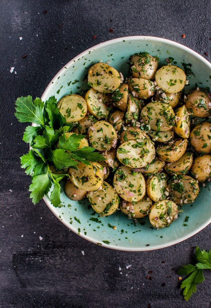 My chimichurri potato salad is packed with flavor from the fresh herbs and garlic! It's the perfect easy to prepare side dish and is ideal for those who do not like creamy potato salad.