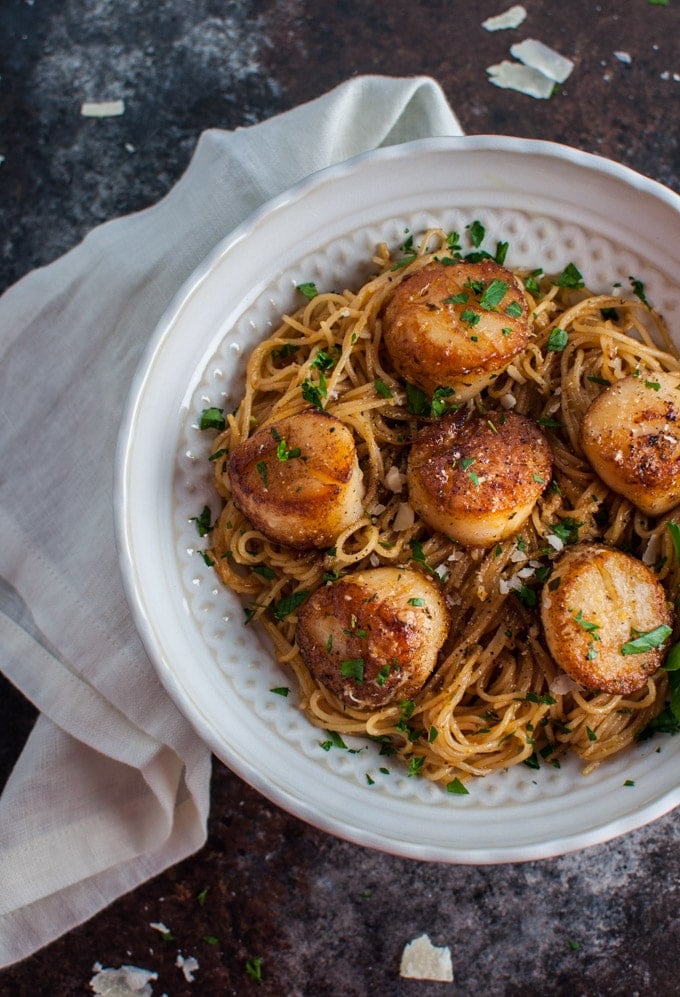 white bowl with chipotle lemon tarragon scallops with angel hair pasta