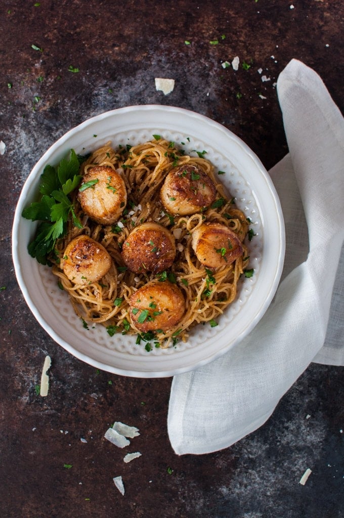 chipotle tarragon lemon scallops with angel hair pasta in a bowl