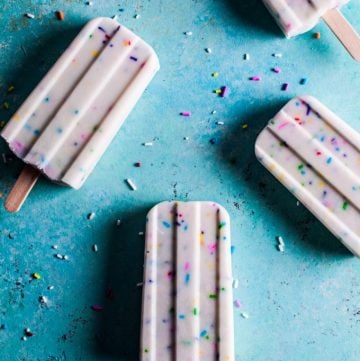 These vanilla Greek yogurt funfetti popsicles are super cute and easy to make - only 4 ingredients are needed! Kids and adults alike will love them!
