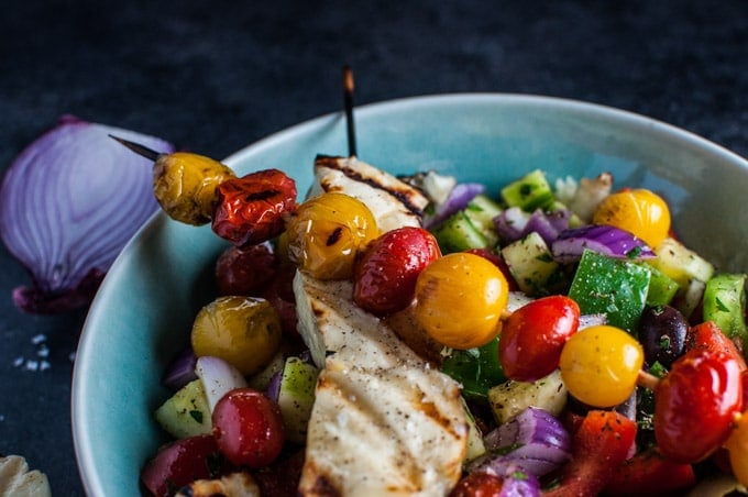 close-up of grilled halloumi and tomato skewers