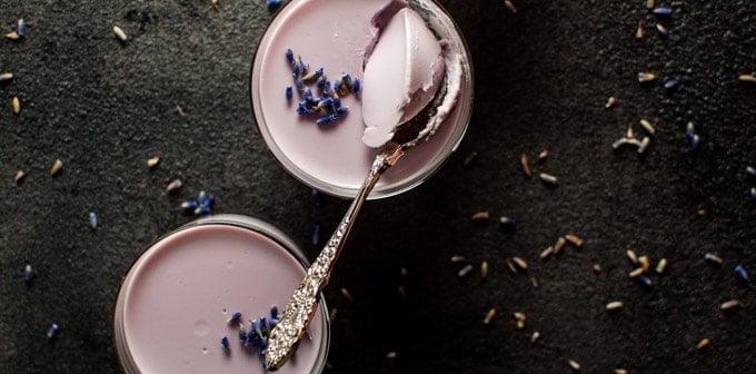 close-up of lavender panna cotta with a spoon