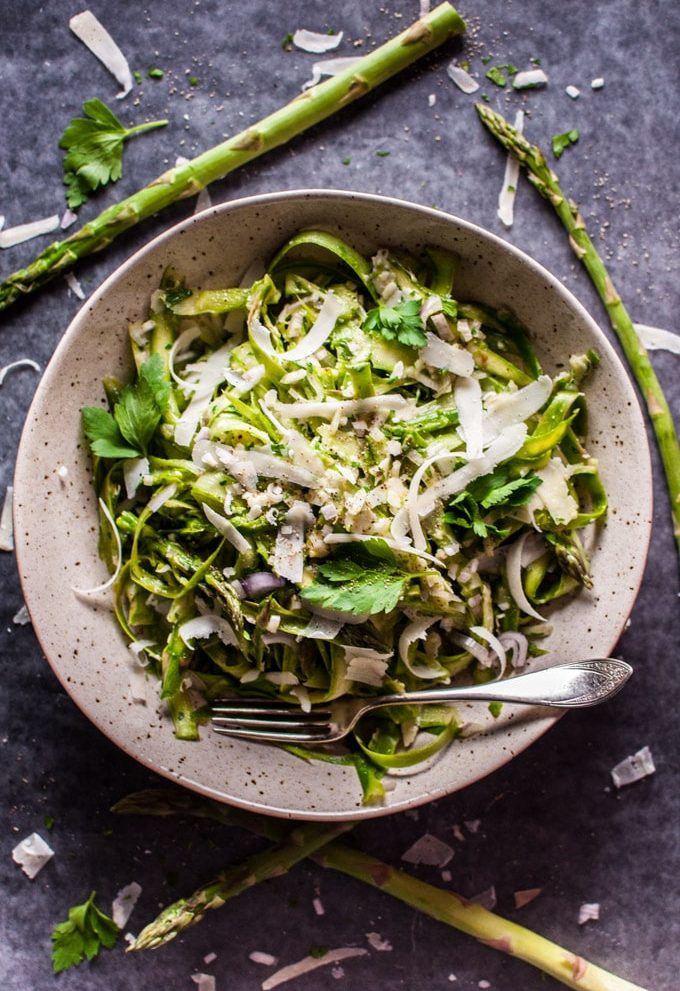 This shaved asparagus salad comes to life with a delicious lemon-Dijon dressing, shallot, fresh parsley, and parmesan cheese. It makes an awesome side salad and will take any meal to the next level!