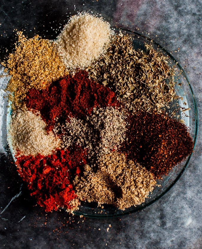 a glass plate with various spices