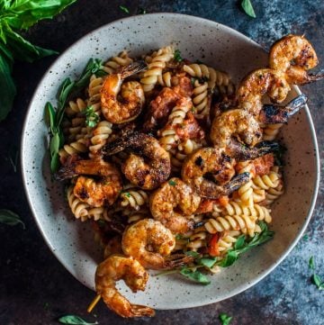 This spicy pasta with grilled shrimp is a marriage made in food heaven. The shrimp are to die for!