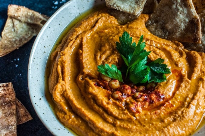 close-up of vegetarian roasted red pepper hummus with sriracha