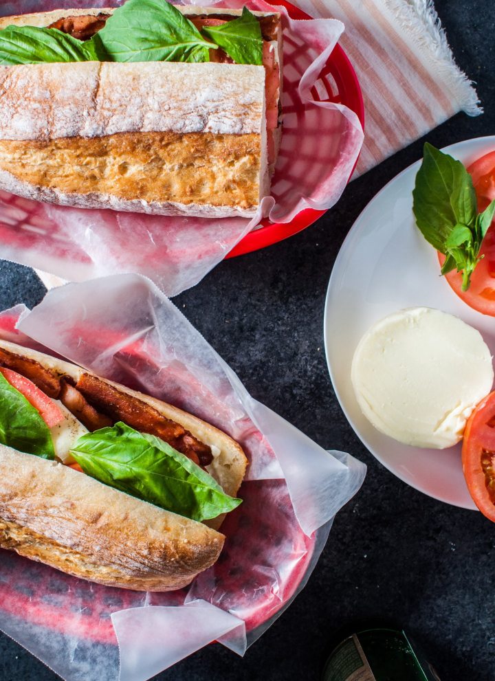This bacon caprese sandwich is an Italian take on the classic BLT. Fresh mozzarella, basil, juicy tomatoes, and plenty of crispy bacon make this sandwich a winner!