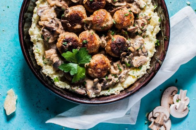 close-up of bowl with chicken meatballs in a creamy mushroom sauce