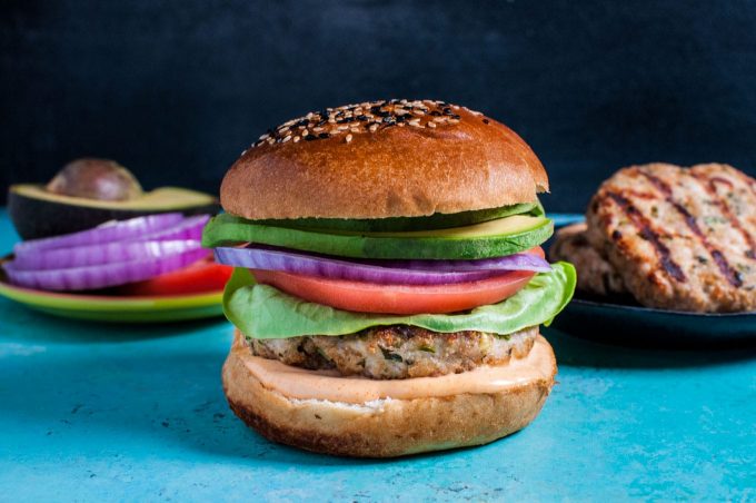 chicken burger with condiments on the side