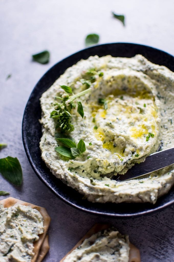 whipped feta spread with fresh herbs in a bowl