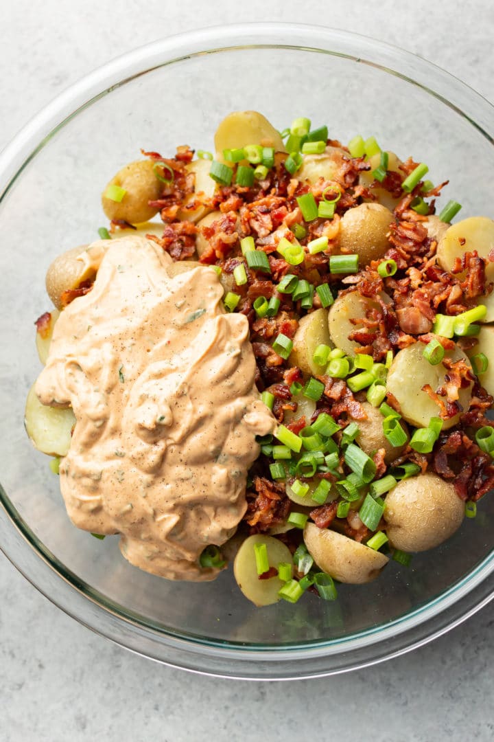 best potato salad with bacon ingredients (not tossed) in a glass prep bowl