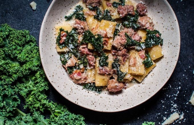 bowl of one-pot rigatoni with sausage, bacon, and kale