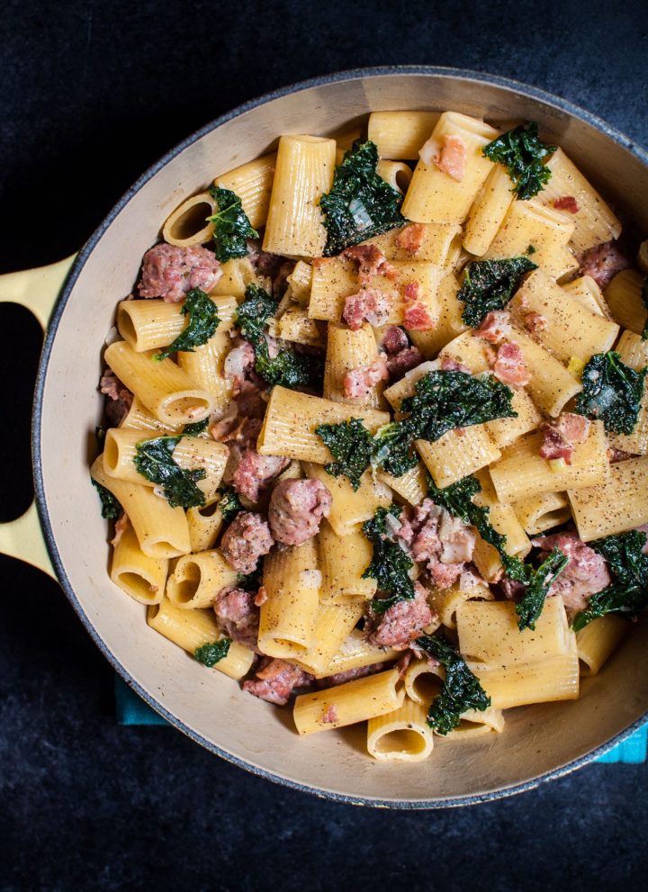 One pot rigatoni with sausage, bacon, and kale is the ultimate comfort food for pasta lovers!